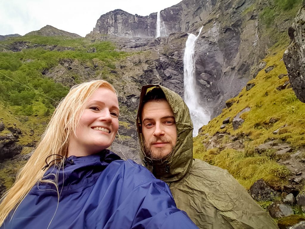 Together in ponchos in front of Mardalsfossen